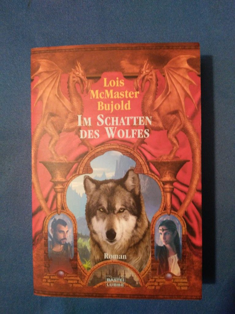 Im Schatten des Wolfes : [Roman]. Ins Dt. übertr. von Alexander Lohmann / Bastei-Lübbe-Taschenbuch ; Bd. 20547 : Fantasy - Bujold, Lois McMaster